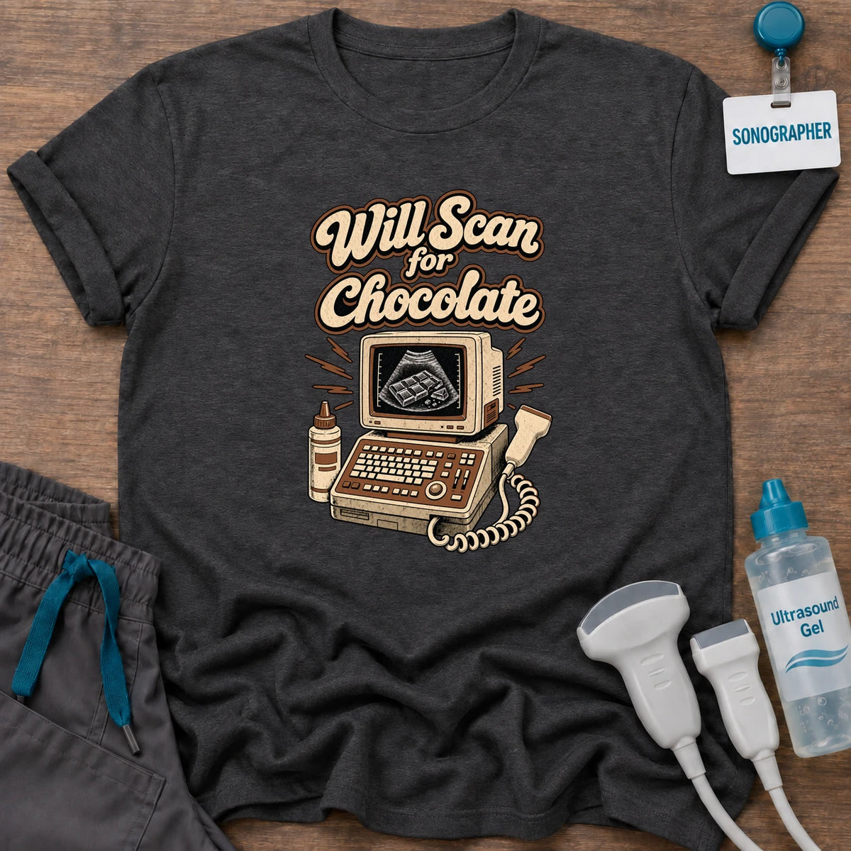 Will Scan for Chocolate Retro Ultrasound sonographer t-shirt with a vintage ultrasound machine showing a chocolate bar on the screen under the words “Will Scan for Chocolate”, in Dark Heather, by Sono Graphics