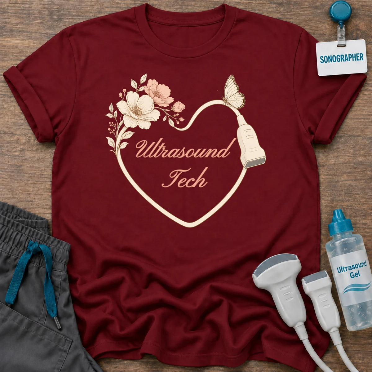 Ultrasound Tech Floral Heart t-shirt with a heart drawn by a transducer cord with blush flowers, a butterfly and “Ultrasound Tech” in peach script, in Cardinal Red, by Sono Graphics