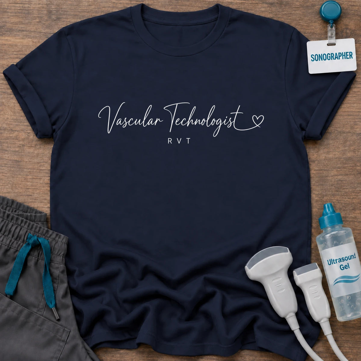Cursive Heart Vascular Technologist t-shirt with “Vascular Technologist” in delicate white script with a small heart and RVT underneath, in Navy, by Sono Graphics