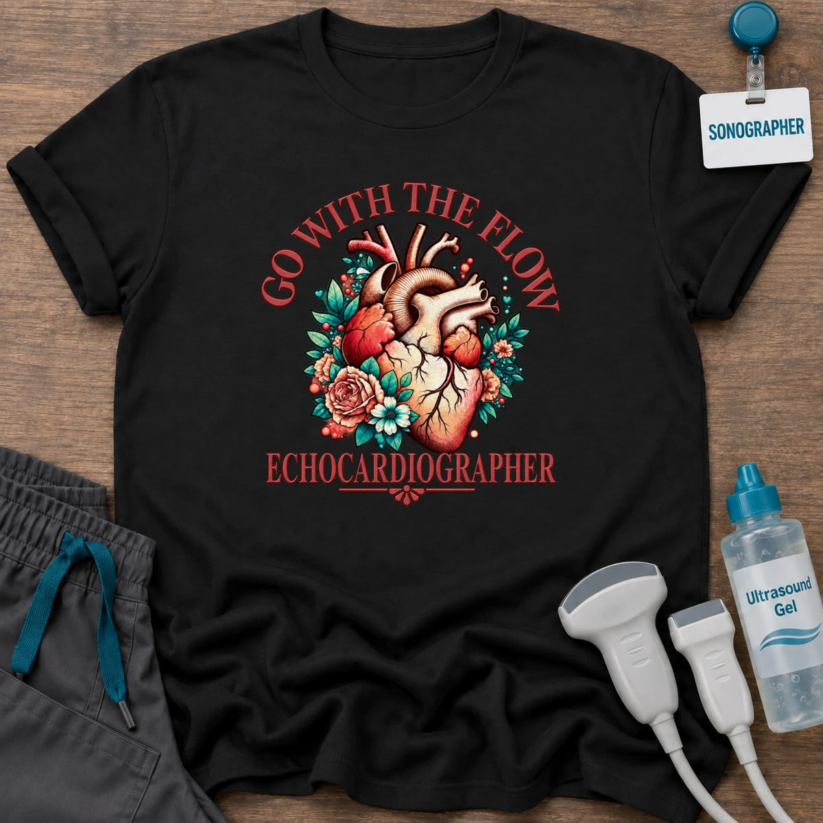 Go With the Flow Echo sonographer t-shirt with an anatomical heart in red roses and teal leaves and the word Echocardiographer, in Black, by Sono Graphics