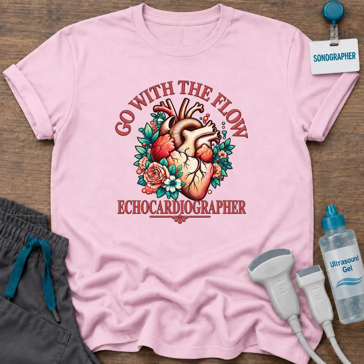 Go With the Flow Echo sonographer t-shirt with an anatomical heart in red roses and teal leaves and the word Echocardiographer, in Light Pink, by Sono Graphics
