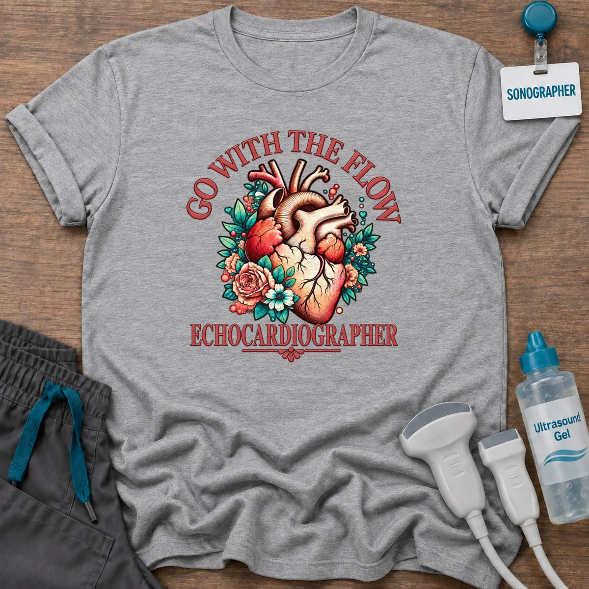 Go With the Flow Echo sonographer t-shirt with an anatomical heart in red roses and teal leaves and the word Echocardiographer, in Sport Grey, by Sono Graphics