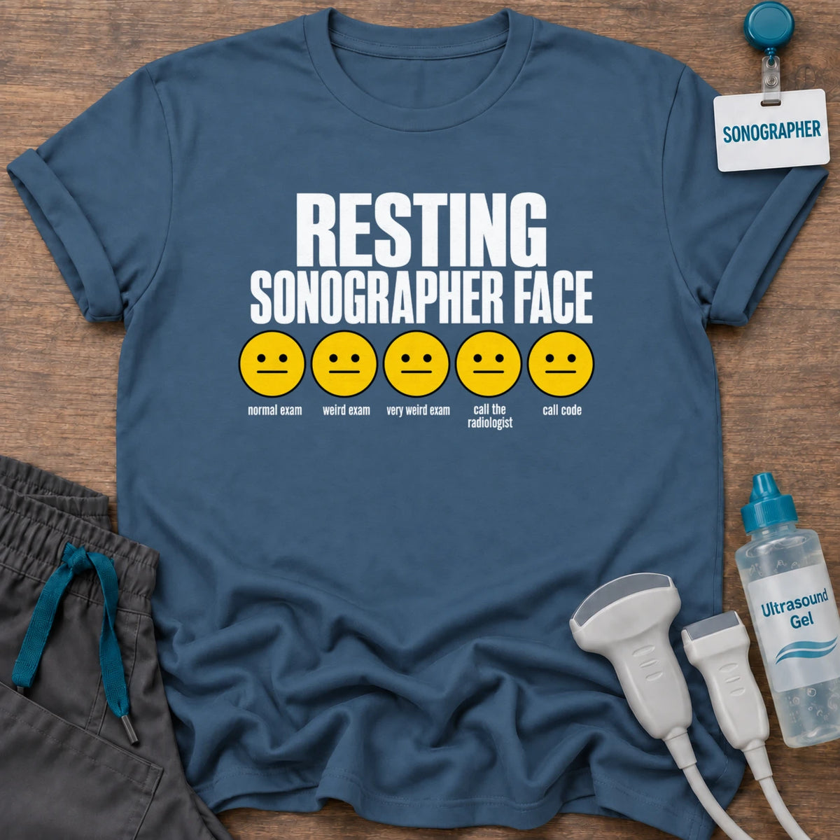 Resting Sonographer Face t-shirt with five emoji faces from normal exam to call the radiologist, in Indigo Blue, by Sono Graphics