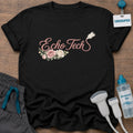 Floral Echo Tech t-shirt with “Echo Tech” in rose-pink script with a transducer tail and a cluster of pink and cream roses, in Black, by Sono Graphics